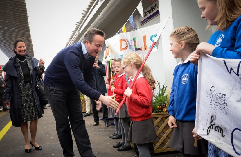 Prime Minister David Cameron greets local school children at Dawlish Station